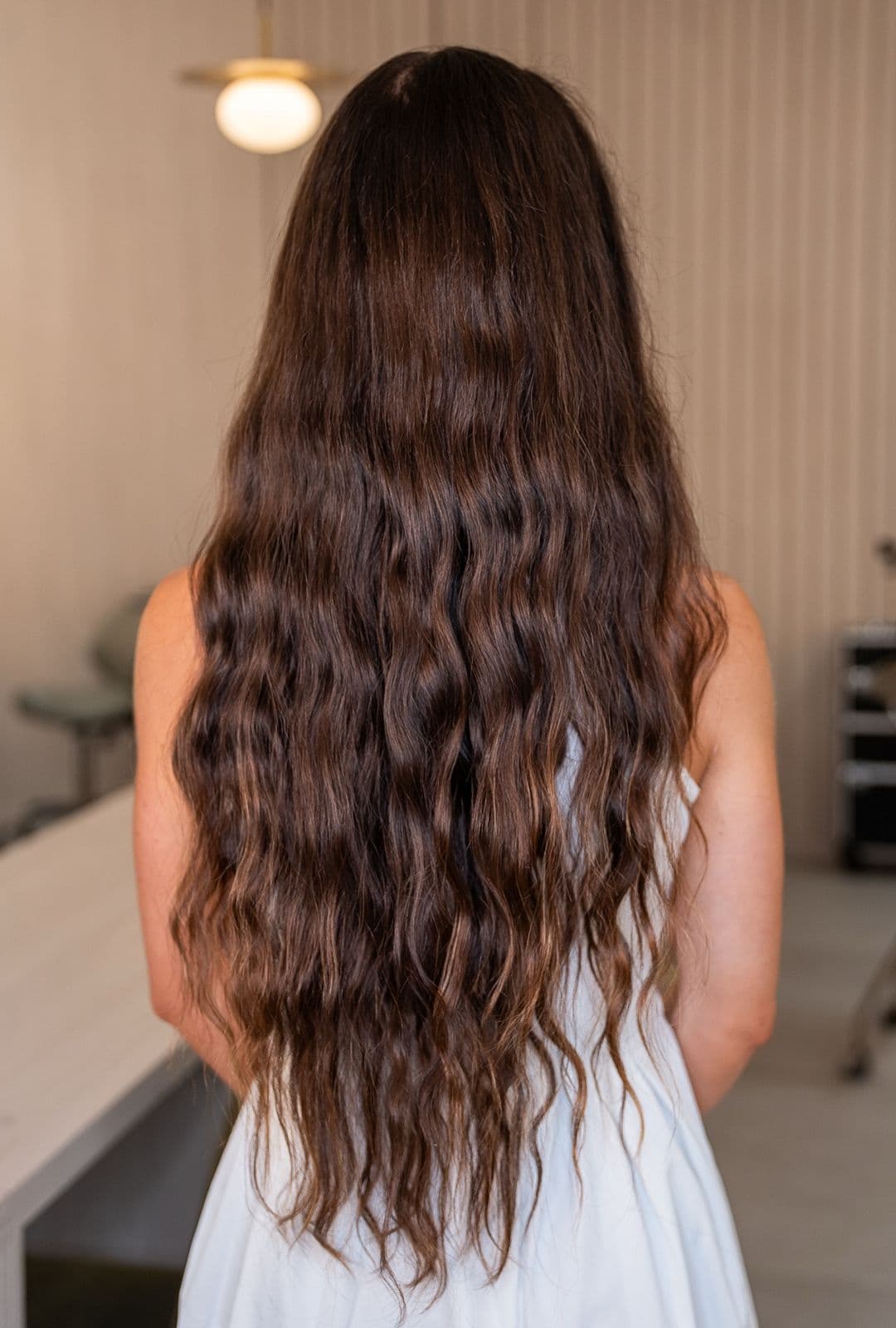 Client's wavy brunette hair, textured and dull, before the Botox — Brazilian Blowout